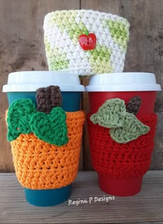 crocheted coffee cups sitting next to each other