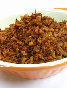 a bowl filled with food sitting on top of a table