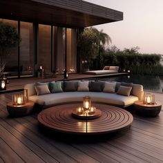 an outdoor seating area with candles on the table