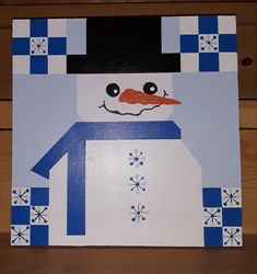 a painting of a snowman wearing a black hat and blue shirt with white checkers on it