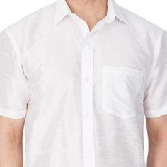 Vastramay brings to you this Stylish yet Comfortable Men White Ethnic South Indian Shirt. Adorn it for a perfect Classy and Trendy look. These Shirts are usually very popular in Souther part of the Sub Continent. These are also called Madras Shirt. It is worn along with a trouser or a jeans. However, traditionally it is paired with a mundu or a white dhoti. The set is also called as Shirt Vesty. Product Features :   Top Color: White Top Fabric: Cotton Art Silk Product Type: Ethnic South Indian S Casual Short Sleeve Kurta For Festive Occasions, Festive Cotton Short Sleeve Shirt, Festive Short Sleeve Cotton Shirt, Festive White Cotton Shirt, Festive White Short Sleeve Top, Madras Shirt, Cotton Art, Cutaway Collar, Top Fabric