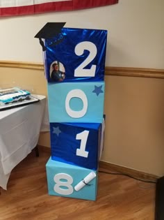 a blue block with the number two on it and a graduation cap sitting on top