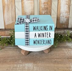 a blue and white box with a bow on it that says walking in a winter wonderland