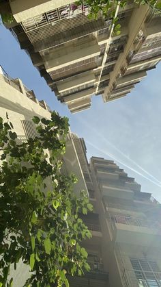 looking up at an apartment building from the ground