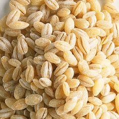 a pile of sunflower seeds sitting on top of a table