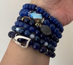 Blue beaded bracelets Elegant Blue Stackable Beaded Bracelets, Blue Stacked Bracelets With Round Beads, Adjustable Stacked Blue Bracelets, Blue Crystal Bracelet With Stackable Round Beads, Luxury Blue Hand-strung Beaded Bracelets, Blue Beaded Bracelets, Bracelet Stack, Stretch Bracelets, Dark Blue