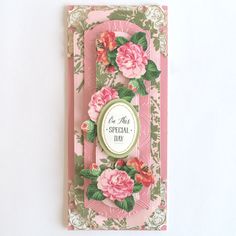 a pink card with flowers on it and a tag that says, for the special day