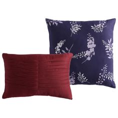 two red and blue pillows with white flowers on the front, one in purple and the other in maroon