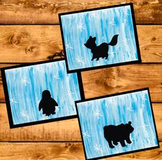 three pictures of cats and snowflakes are shown on the wood floor with blue background