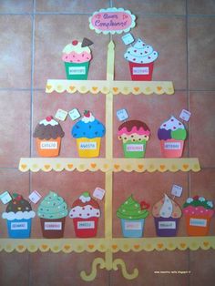 the cupcakes are arranged on top of each other in different colors and shapes