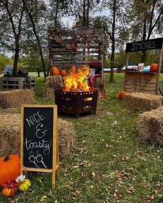 hay bales and pumpkins are set up in the yard for an outdoor bbq