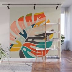 an abstract painting on the wall in a living room