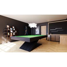 a pool table in the middle of a room with bookshelves on either side