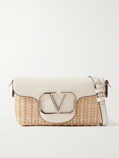 VALENTINO GARAVANI Locò embellished leather-trimmed raffia shoulder bag | NET-A-PORTER Designer Rectangular Straw Bag In Natural Color, Designer Rectangular Natural Straw Bag, Designer Beige Straw Shoulder Bag, Designer Rectangular Straw Bag With Braided Handles, Luxury Rectangular Straw Bag With Detachable Strap, Designer Rectangular Straw Bag With Gold-tone Hardware, Designer Woven Straw Shoulder Bag, Designer Natural Straw Shoulder Bag, Designer Woven Shoulder Bag For Vacation