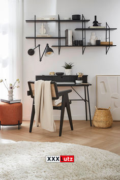 a living area with a table, chairs and shelves