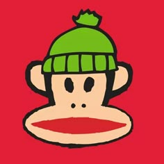 a drawing of a monkey wearing a green knitted hat with a red circle underneath it