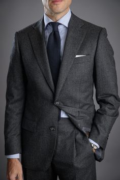 Flannel is traditionally made from a carded/woolen wool or worsted yarn. Flannel may be brushed to create extra softness like in this case, or remain un-brushed. By brushing the fabric, it creates a beautiful and sophisticated marbling you see, giving more depth to this charcoal suit.

Dry-clean only. Timeless Gray Wool Suits, He Spoke Style, Grey Suit Men, Charcoal Gray Suit, Suit Combinations, Charcoal Suit, Mens Wedding Attire, Most Stylish Men, Flannel Suit