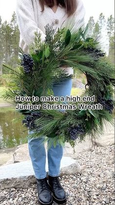 a girl holding a wreath with the words how to make a high end jumper christmas wreath