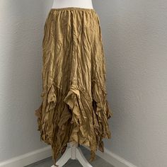 Surrealist Gold Asymmetrical Long Skirt Size 1 Equivalent To Womens Small Fall Asymmetrical Hem Ruffled Skirt, Bohemian Skirt With Asymmetrical Hem, Bohemian Asymmetrical Skirt For Fall, Bohemian Fitted Skirt With Asymmetrical Hem, Asymmetrical Beige Bottoms For Spring, Bohemian Maxi Skirt With Asymmetrical Hem For Spring, Spring Bohemian Maxi Skirt With Asymmetrical Hem, Beige Asymmetrical Hem Bottoms For Fall, Spring Fitted Wrap Skirt With Handkerchief Hem