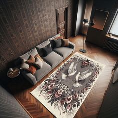 a living room with a couch and rug on the floor