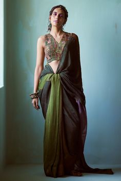 Green chiffon saree with textured hand embroidery. Comes with a blouse with assorted patchwork.
Components: 2
Pattern: Hand embroidered
Type Of Work: Textured, Assorted patchwork
Neckline: V Neck
Sleeve Type: Sleeveless
Fabric: Chiffon
Color: Green
Other Details: 
Closure: Blouse - Back tie-up
Occasion: Wedding - Aza Fashions Green Chiffon Saree, Embroidered Saree, Blouse For Women, Chiffon Saree, Saree With Blouse, Blouse Online, Green Blouse, Aza Fashion, Sleeve Type