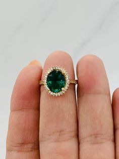 ❤️ 10k solid gold women's ring size 7 ❤️ Women's jewelry -cocktail ring - fine jewelry  ❤️ May birthstone emerald color or august birth month in green peridot color  ❤️ Green Cubic Zirconia approx 10mm carat in size  ❤️ White cubic zirconia on sides  ❤️ Anillo de mujer con zirconia verde y blanca  ❤️ Anillo en oro de 10 Kilates   ❤️ Color Verde nacimiento mes de Mayo color esmeralda o verde color peridot mes de agosto  ❤️ Esta piedra zirconia es aproximadamente 10 milímetros ❤️ Joyería fina  ❤️ Sortija estilo coctel  Stock #04213 14k Gold Green Emerald Ring With Halo, Gold Emerald Halo Ring, Heirloom Green Halo Jewelry, 14k Gold Green Gemstone Halo Ring, Gold Emerald Ring With Halo For May Birthstone, Green Gemstone Halo Ring In 14k Gold, 14k Gold Green Halo Ring, 14k Gold Emerald Halo Ring For May Birthstone, Gold Emerald Halo Ring For May Birthstone