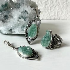 Handmade sterling silver jewelry set for women and girls. The set includes a ring and earrings. The stones are raw fluorite in green color. The pear shape of the fluorite stone and the design of this set are eye-catching. You can wear this set both every day, and on special days. If you are looking for the best gift idea and want unique and not mass-produced jewelry, you are in the right place.  e offer only high-quality and exclusive designs with only natural stones and minerals.  By custom ord Green Sterling Silver Jewelry With Raw Stone, Silver Fluorite Jewelry With Natural Stones, Silver Fluorite Jewelry As A Gift, Silver Fluorite Gemstone Jewelry, Silver Fluorite For Jewelry Making, Green Stone Jewelry, Fluorite Ring, Raw Fluorite, Raw Stone Jewelry