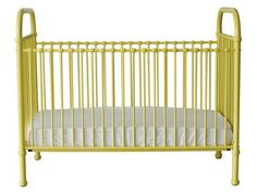 a yellow crib with white sheets on the bottom and side rails, against a white background