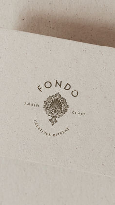 the logo for fondo is shown on top of a piece of paper that has been folded