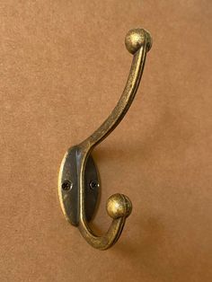 a close up of a metal hook on a wall