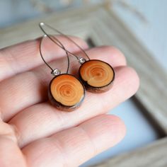 I made these long dangle earrings from sterling silver circles and natural wood. I found a beautiful tree branch in the forest and decided to give it a second life :) I cut the branch into slices, sanded and joined with sterling. Very woody earrings. Great gift made of wood, for her and for all nature lovers. These earrings are very light. Only one pair is available. The earrings are about 5 cm (2'') long and they are very light. You will receive this item carefully wrapped in wooden jewelry box Natural Wood Drop Earrings, Natural Wood Drop Earrings For Pierced Ears, Natural Wood Jewelry Gift, Handmade Round Natural Wood Jewelry, Brown Circular Jewelry Gift, Natural Wood Nature-inspired Jewelry, Elegant Natural Wood Jewelry For Gift, Brown Circular Earrings As Gift, Brown Circular Earrings For Gift