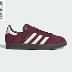 Brand New NWT Adidas Gazelle Originals Sneakers in Maroon Size Men 5.5/Women 6.5. Gorgeous on trend oxblood burgundy cherry mocha wine color 🍒. Never worn and box included. Sold out on Adidas site. These are a Men 5.5 but fit a Women size 6.5 according to the Adidas size chart. I think they run a bit big so please read sizing reviews. *Will ship same day if ordered before 12pm Est M-Sat excluding holidays. From soccer fans in the '60s and '70s to skaters and indie rockers in the '90s, the adidas Gazelle shoes have traversed the cultural landscape & globe. These sneakers are a one-to-one reissue of the 1991 Gazelle, with the same materials, proportions and textures as the original. A suede upper with tonal serrated 3-Stripes and the classic T-toe adds timeless style. SPECIFICATIONS • Lace Cherry Mocha, Adidas Gazelle Shoes, Gazelle Shoes, Off White Shop, Sneaker Shop, Adidas Spezial, Dressy Fashion, Adidas Sneaker, Soccer Fans