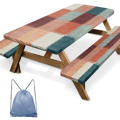 a picnic table with two benches and a drawstring bag