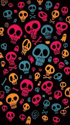 many different colored skulls on a black background