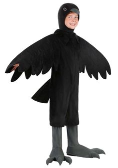 a young boy in a black bird costume