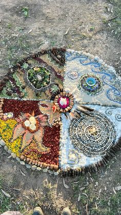 a person's feet standing in front of a circular rug with flowers on it