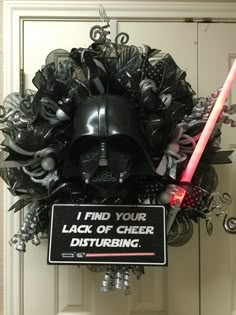 star wars wreath with darth vader mask and lightsaben sticker on it