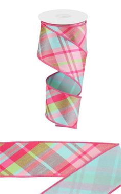 two rolls of pink and green plaid ribbon next to each other on a white background