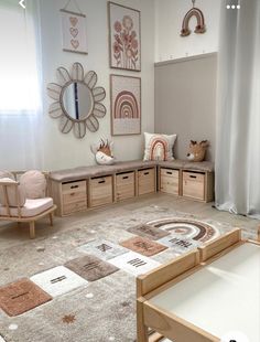 a living room filled with lots of furniture next to a wall mounted art work on the wall