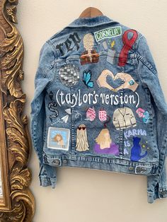 a denim jacket hanging on the wall next to a mirror