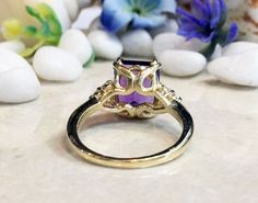 Don't miss this opportunity to own this beautiful gemstone ring crafted in 14k gold filled => Gemstone Type - Amethyst, Clear Quartz => Gemstone Cut - Faceted => Gemstone Size - 8*10 mm, 2 mm => Total Number of Gemstones - 7 => Metal Type - 14k Gold Filled (Tarnish Resistant And Nickel Free) - also available in 925 sterling silver * Please contact me for pricing on a sizes larger than 11 * ~ Feel free to ask me about custom made designs. ❏ Replacements and custom orders : ✪ 925 st Square Cut Rings With Accent Stones For Wedding, Square Cut Rings With Accent Stones For Anniversary, Yellow Gold Rings With Rectangular Accent Stones, Emerald Cut Diamond Ring With Gemstone Accents For Promise, Anniversary Ring With Rectangular Halo Setting, Square Cut Promise Ring With Accent Stones, Emerald Cut Diamond Promise Ring With Gemstone Accents, Rectangular Gemstone Rings For Anniversary, Square Cut Gemstone Ring For Anniversary