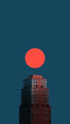 an orange object is in the sky above a tall building with windows and dark blue background