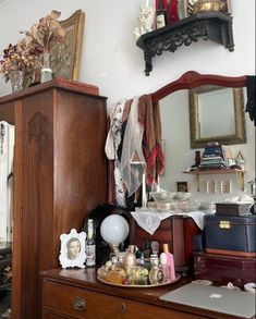 an old dresser with many items on it