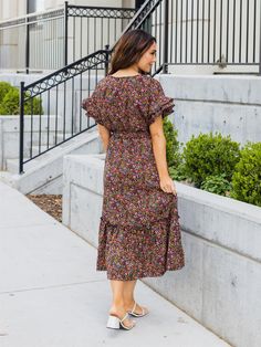 Looking for a dress that will make you stand out in a crowd? Look no further than the Floral Belted Whitney Dress in black floral! This dress is all about fun and flirty style, with a colorful floral print that's sure to turn heads. But it's not just about looks - this dress is designed to flatter your curves, with a tie waist that accentuates your figure. And with flutter sleeves and a midi length, it's the perfect combination of playful and sophisticated. Whether you're headed to a wedding, a Fall Floral Print Short Sleeve Dresses, Spring Black Floral Dress, Black Floral Dress For Spring, Black Floral Print Spring Dress, Black Floral Print Dress For Spring, Spring Multicolor Ditsy Floral Maxi Dress, Black Ditsy Floral Dress For Summer, Black Ditsy Floral Print Dress For Summer, Black Summer Dress With Ditsy Floral Print