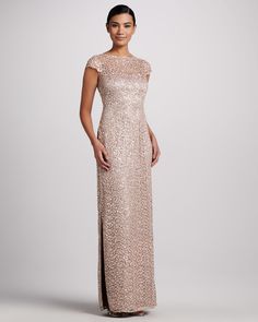 a woman wearing a long dress with sequins on it