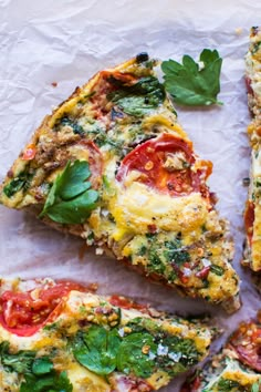 several slices of quiche with tomatoes, cheese and herbs