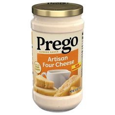 a jar of artisan four cheese spread on a white background with gold trim around the top