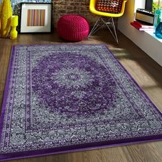 a large purple rug in the middle of a room