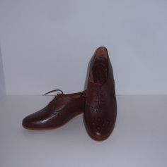 Vintage Town & Country classic brown spectator tie oxford shoes.  Deadstock.  Never worn.  Women's size 8.5  MEDIUM.  Heel height-1.5".  Made in Brazil. Classic Brown Closed Toe Lace-up Shoes, Classic Brown Oxfords With Round Toe, Brown Oxford Loafers With Brogue Detailing, Brown Oxfords With Brogue Detailing And Pointed Toe, Brown Pointed Toe Oxfords With Brogue Detailing, Vintage Oxfords For Business In Fall, Vintage Business Oxfords For Fall, Vintage Brown Lace-up Business Shoes, Brown Loafers For Office