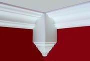 the corner of a red wall with white trim